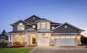 Grey single family home exterior in evening