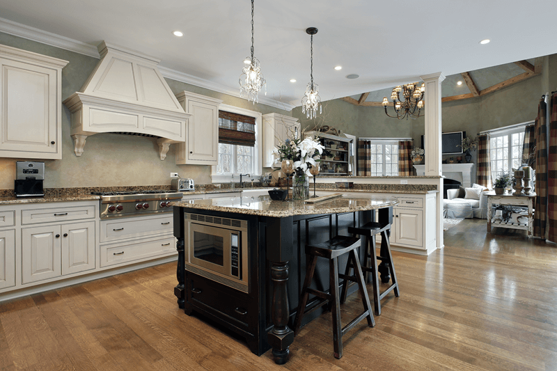 Traditional kitchen with granite countertops and chandeliers